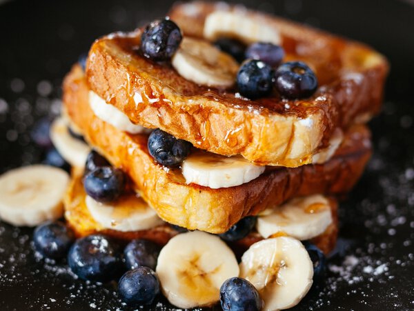 Delicious banana and blueberry toast with maple syrup